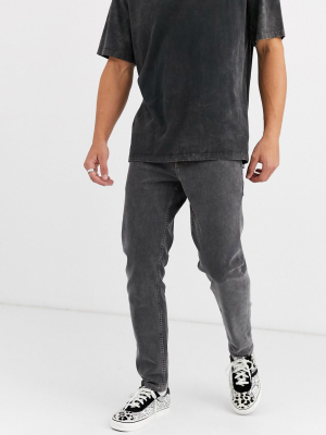 Asos Design Stretch Tapered Jeans In Washed Black