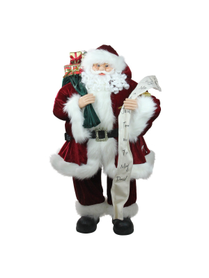 Northlight 36" Red And White Standing Santa Claus Holding A Naughty And Nice List Christmas Figurine