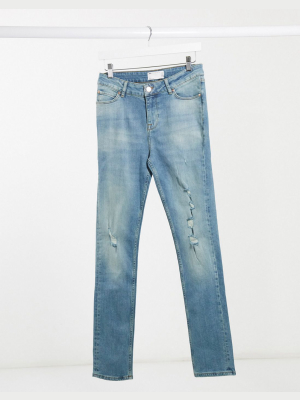 Asos Design Skinny Jeans In Tinted Mid Wash With Rips