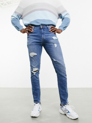 Asos Design 'responsible Edit' Skinny Jeans In Light Wash With Rips