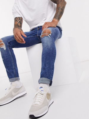 Topman Skinny Jeans With Blowout Rips In Mid Wash Blue