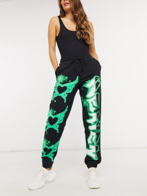 Jaded London Oversized Sweatpants With Neon Butterfly Print