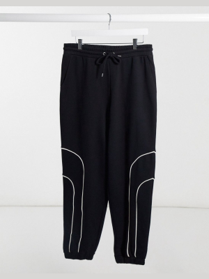 Asos Design Oversized Sweatpants In Black With Bungee Details And Piping