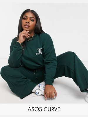 Asos Design Curve Tracksuit Oversized Hoodie / Straight Leg Sweatpants With Take Care Embroidery In Dark Green