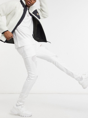 Asos Design Skinny Jeans In White With Heavy Rips