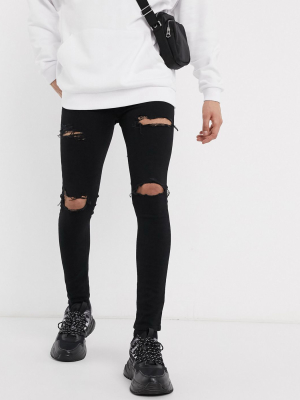 Asos Design Spray On Jeans With Power Stretch In Black With Mid Rips