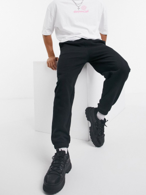 Asos Design Oversized Sweatpants With Narrow Cuffs And Waistband In Black