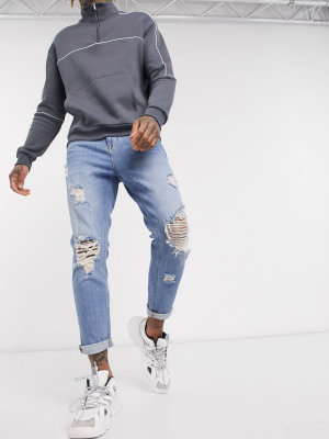 Asos Design Tapered Carrot Jeans In Vintage Light Wash With Heavy Rips