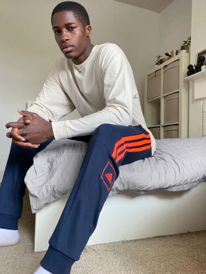 Adidas Skinny 3 Stripe Sweatpants In Navy And Orange