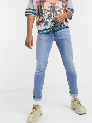 Asos Design Organic Skinny Jeans In Mid Wash Blue