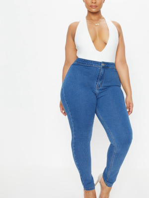 Plus Mid Wash High Rise Skinny Jeans