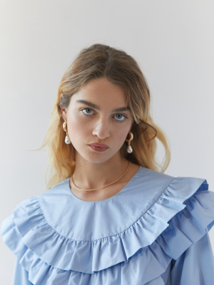 Crās Mavocras Tiered Ruffle Blouse