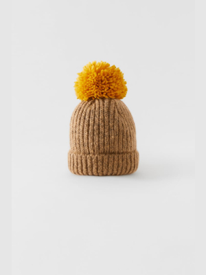 Knit Hat With Contrasting Pompom