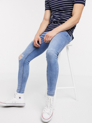 New Look Spray On Ripped Jeans In Mid Wash Blue