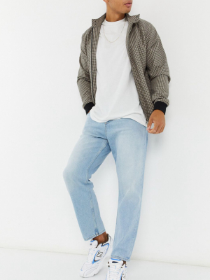 Asos Design Relaxed Tapered Jeans In Vintage Light Blue Stone Wash