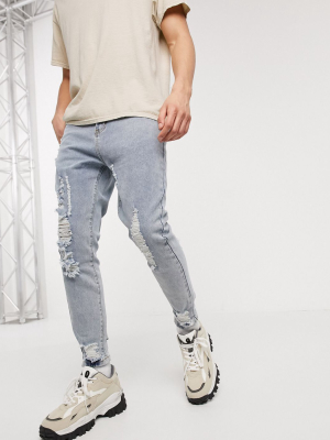 Liqour N Poker Slim Fit Jeans With Knee Abrasions In Light Blue Wash