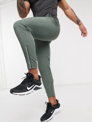 Asos 4505 Woven Skinny Tapered Running Sweatpants With Reflective Zip Detail In Khaki