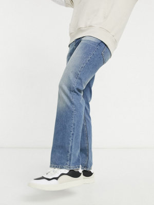 Asos Design Bootcut Jeans In Mid Wash Blue