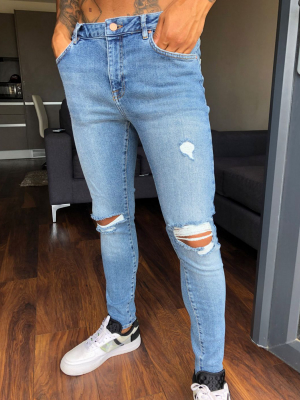 Asos Design Spray On'vintage Look' Jeans With Power Stretch In Mid Wash Blue With Knee Rips