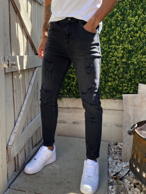 Asos Design Tapered Jeans In Washed Black With Heavy Rips