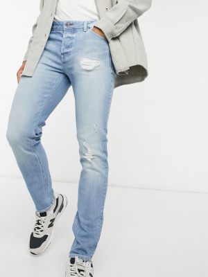 Asos Design Skinny Jeans In Mid Blue Vintage Japanese Wash With Abrasions