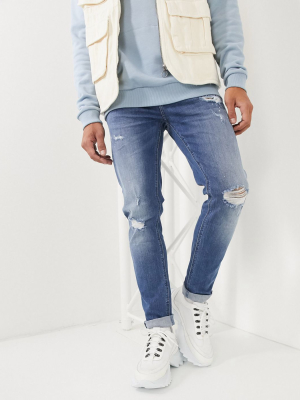 Asos Design Skinny Jeans In Mid Wash Blue With Rips And Destroy
