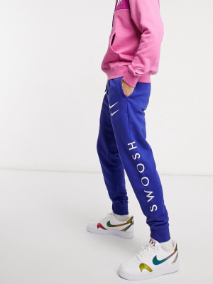 Nike Swoosh Cuffed Sweatpants In Royal Blue