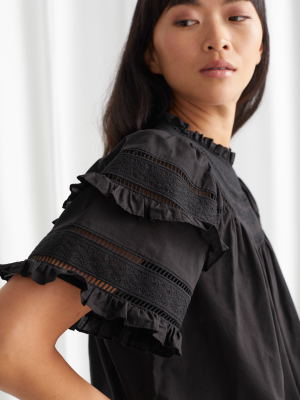 Ruffled A-line Embroidery Blouse