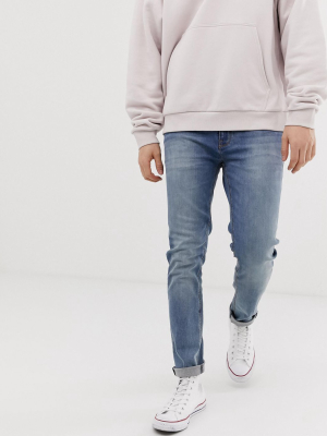 Asos Design Skinny Jeans In Mid Wash