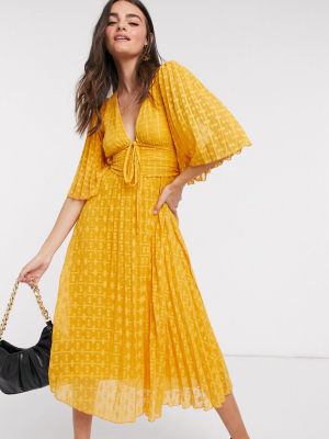 Asos Design Dobby Midi Dress With Lace Up And Fluted Sleeves In Mustard