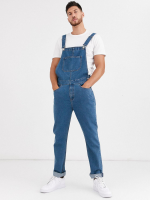Asos Design Relaxed Denim Overalls In Mid Wash Blue