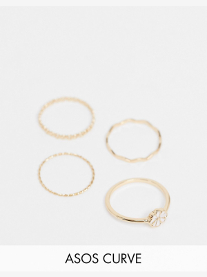 Asos Design Curve Pack Of 4 Rings With Daisy Flower In Gold Tone