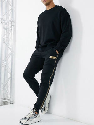 Puma Sweatpants In Black With Gold Taping