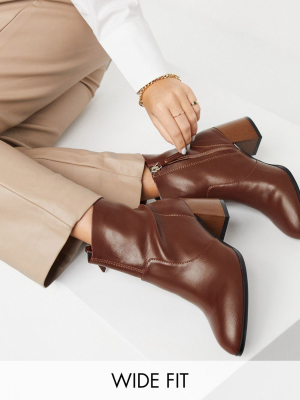 Asos Design Wide Fit Reporter Heeled Boots With Flared Wooden Heel In Tan