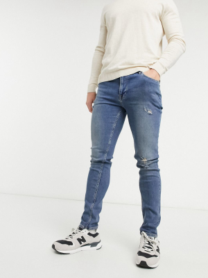 Asos Design Skinny Jeans In Dirty Mid Wash Blue With Abrasions