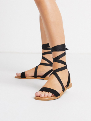 Asos Design Finland Tie Leg Flat Sandals In Black